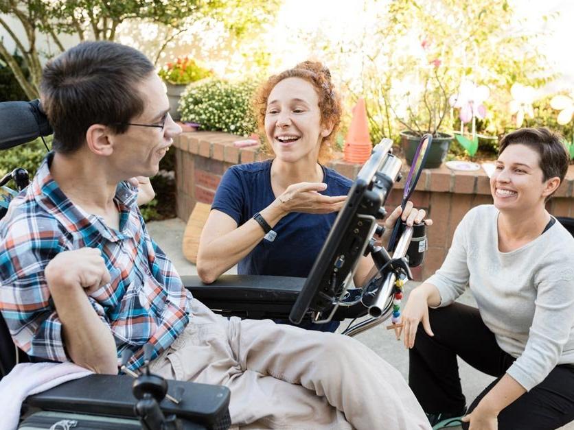 Occupational therapy assist a client during a site visit