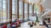 Students studying at tables in George Hall Atrium